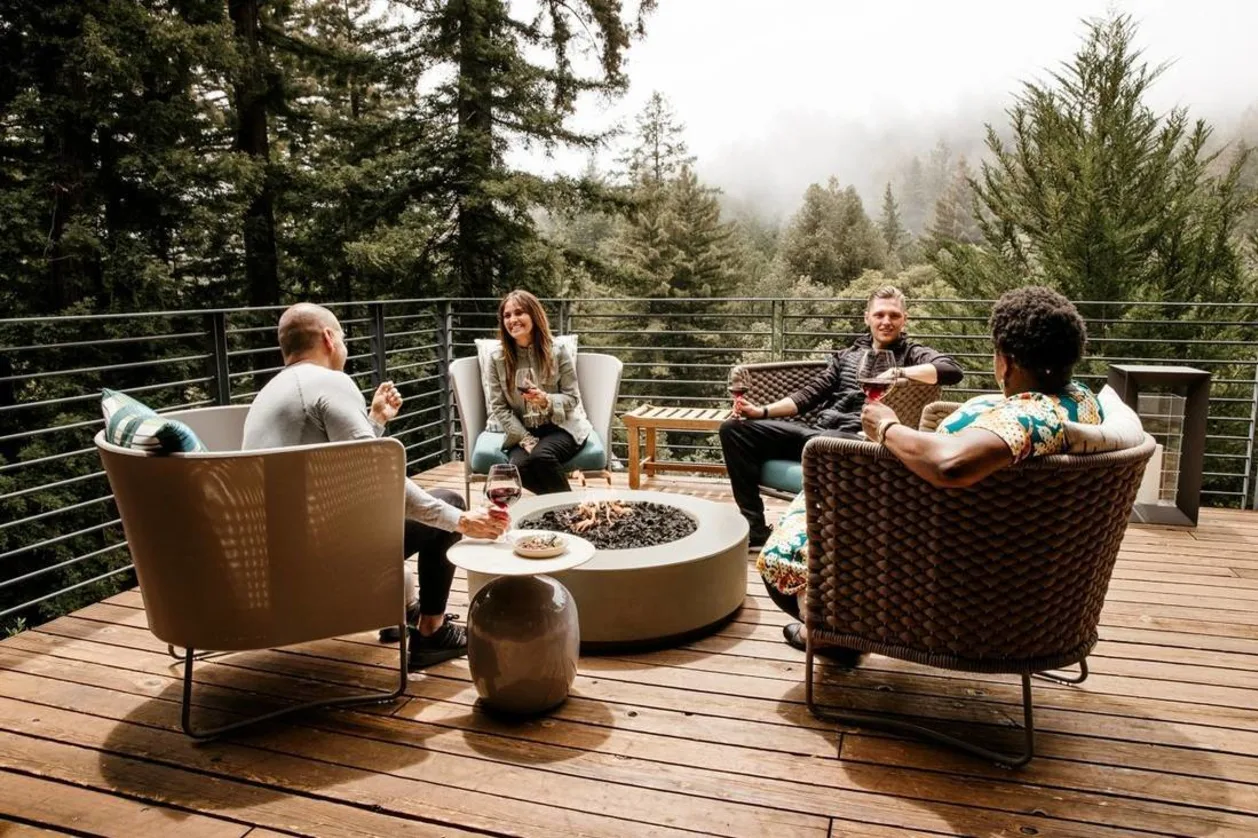 Canyon Ranch Woodside guests around fire pit