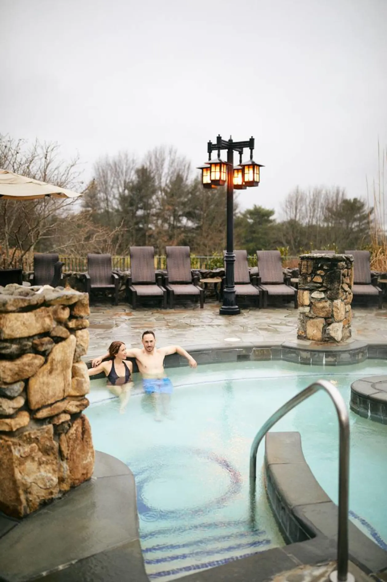 Couple in outdoor spa pool Omni Grove Park Inn