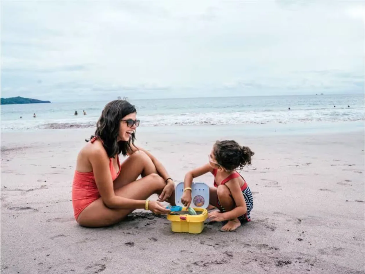 Mom and daughter play on beach at Margaritaville Beach Resort Costa Rica
