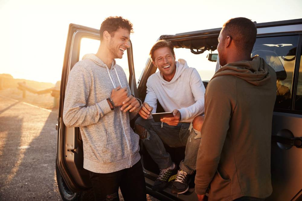 Three male zillennials on road trip