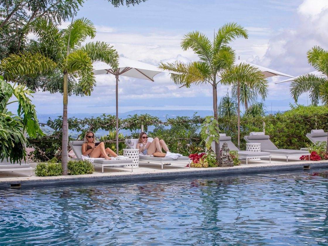Two guests poolside at The Retreat Costa Rica
