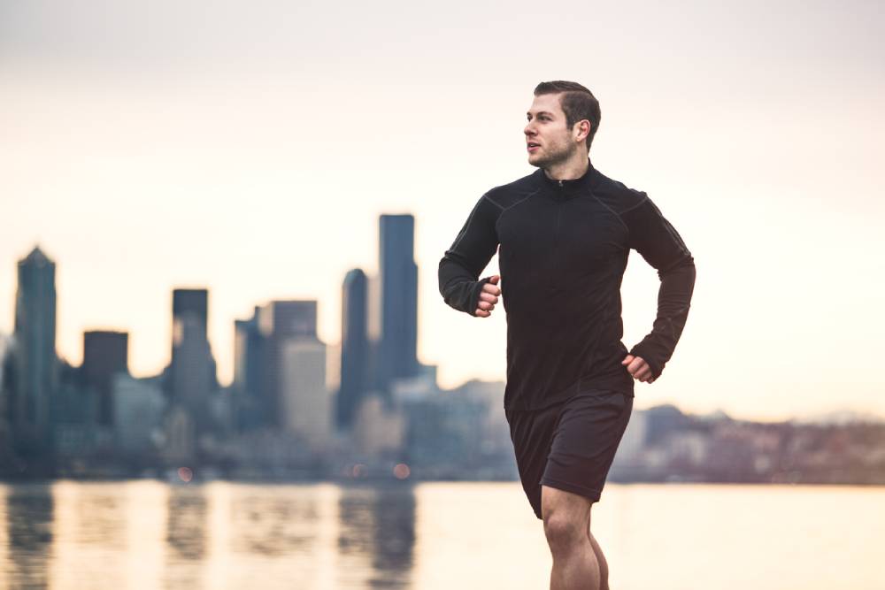 Man running along West Seattle Alki Beach