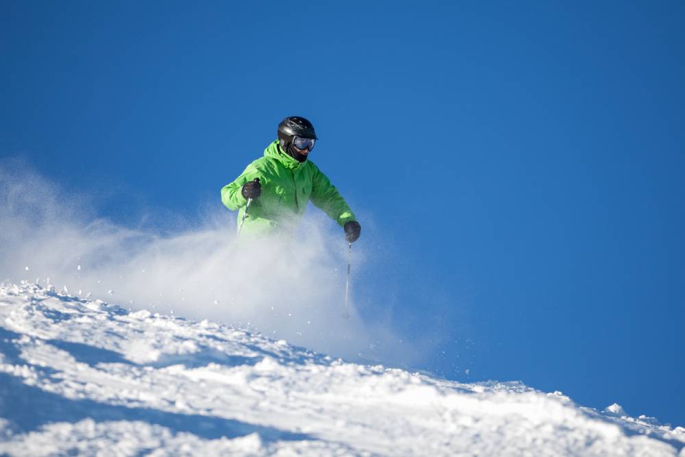 Skier enjoying a sunny day on the slopes Mt. Bachelor