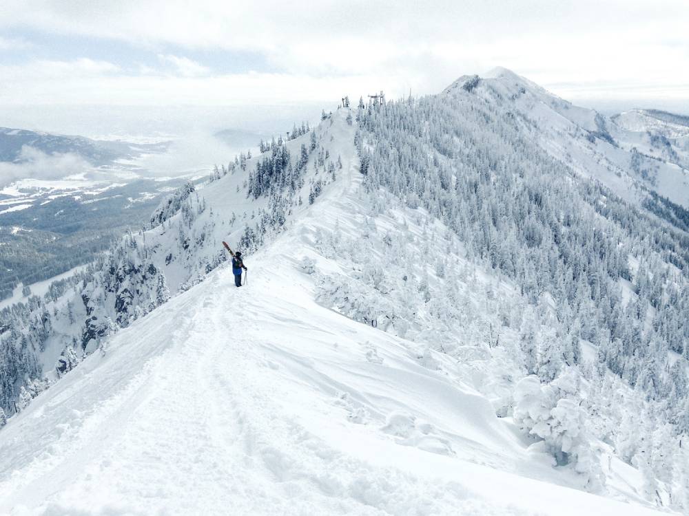Skier hikes across the ridge at Bridger Bowl