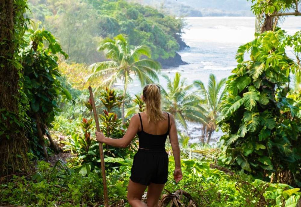 Female guest hiking at 1 Hotel Hanalei Bay