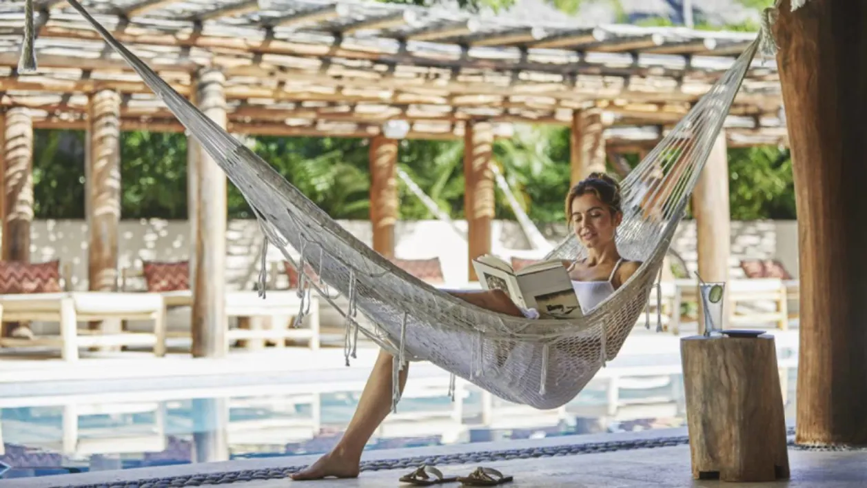 Woman on hammock at Four Seasons Resort Punta Mita