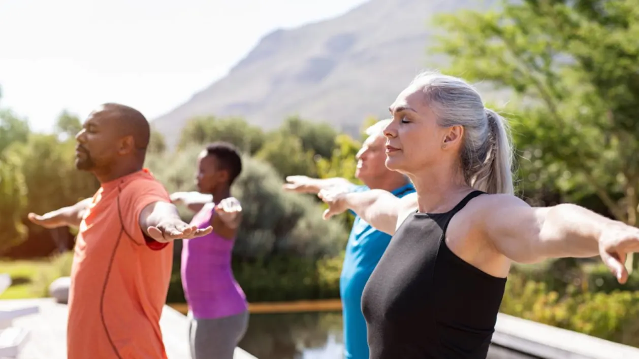 Group of middle aged men and women being mindful