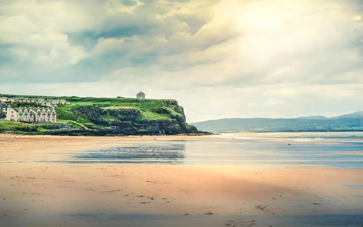 Sun breaks through clouds at Castlerock Beach Northern Ireland