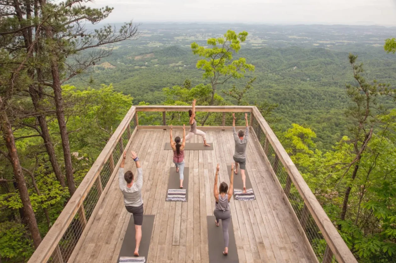 Yoga on the deck in nature at Blackberry Mountain best wellness resort