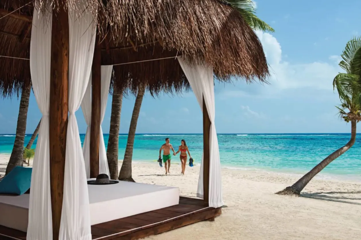 Couple walking to beach cabana at Secrets Akumal Riviera Maya
