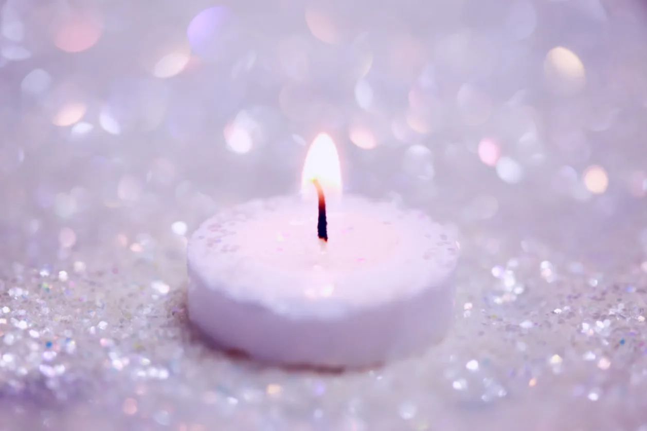 purple candle and sparkles