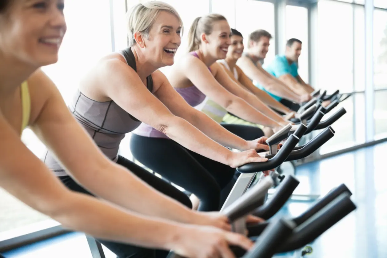 people exercising on stationary bikes