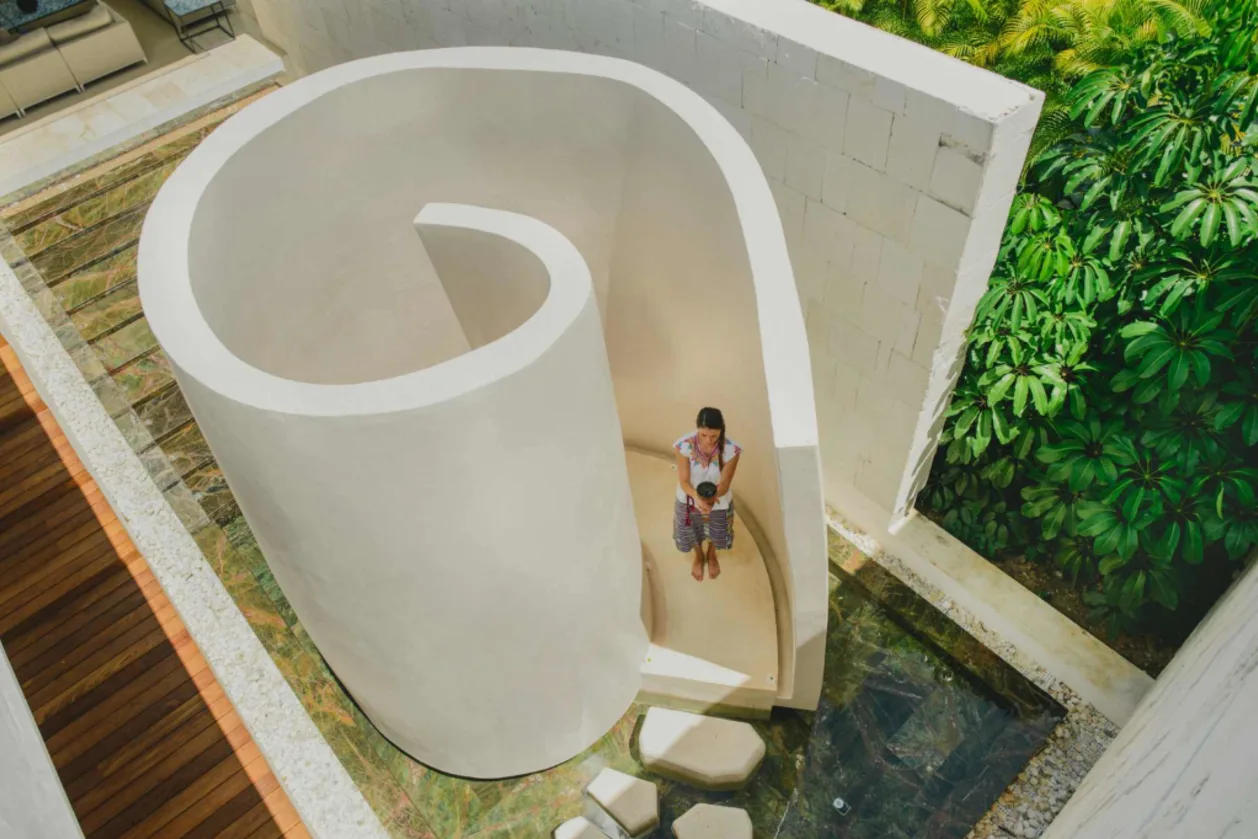 woman in outdoor spiral shower at chable yucatan