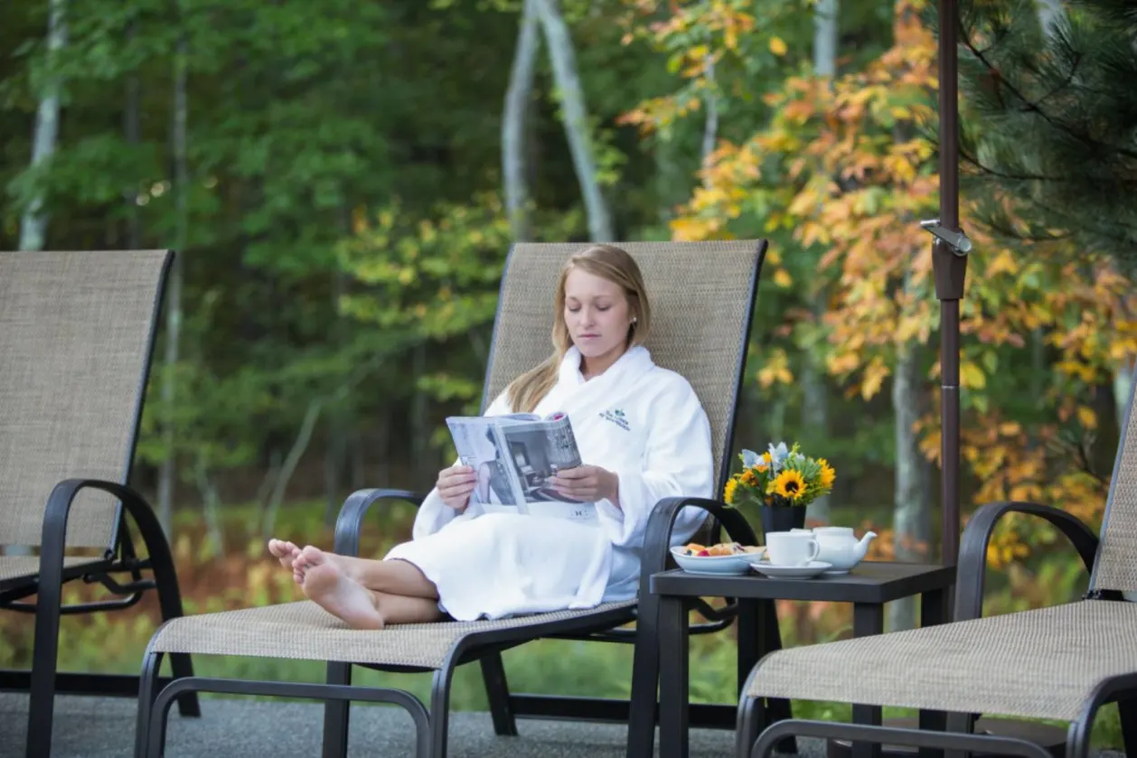 woman in robe on sun terrace at The Lodge at Woodloch