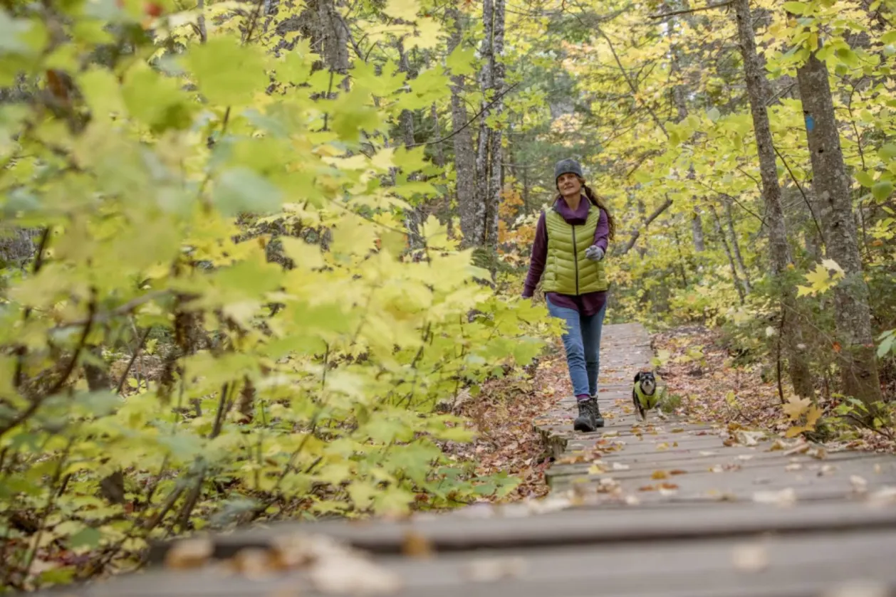 Guest and dog hiking at Keweenaw Mountain Lodge