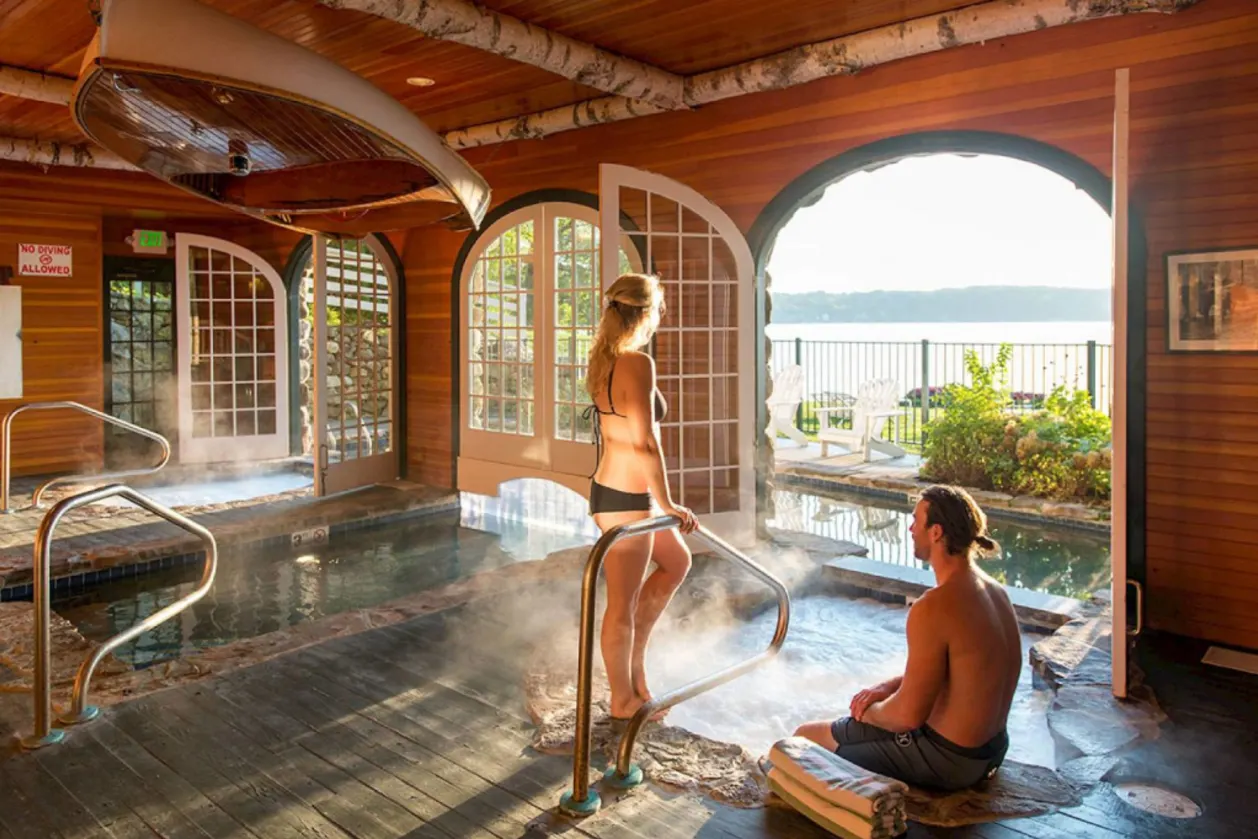 Couple in indoor spa at Mills Falls Resort