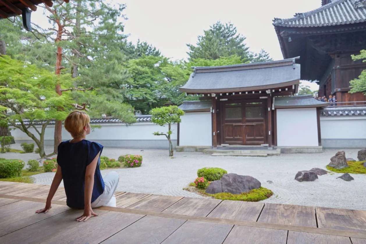 Peaceful moment of woman tourist at Japanese temple