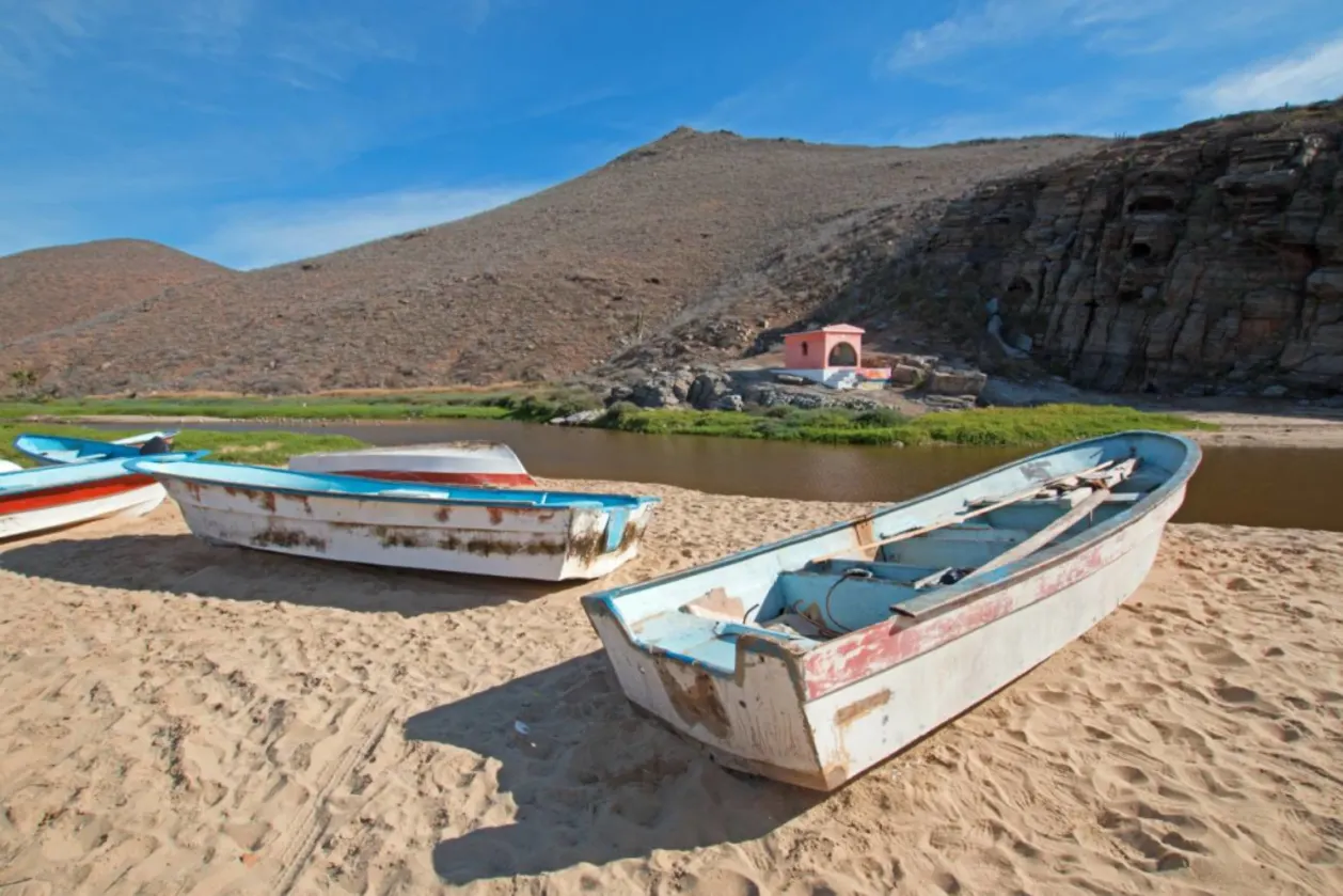 Small fishing boats pongas at punta lobos beach