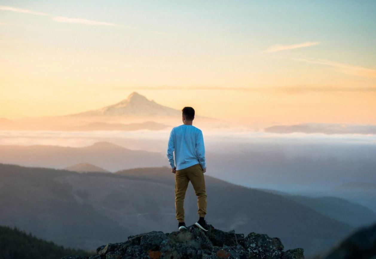 Man on mountain mindfulness concept