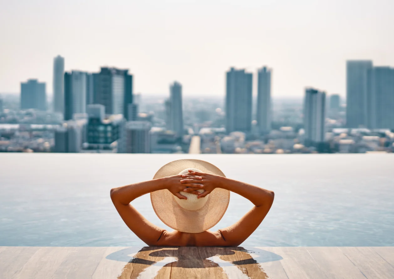 View of a cityscape from a rooftop pool spa staycation