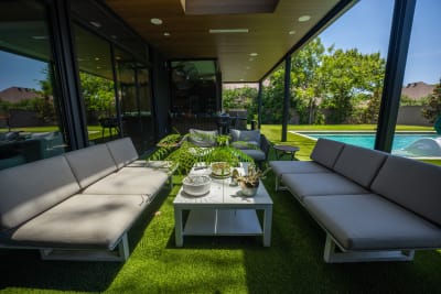 Platinum and Pebble: A Dallas Family's Outdoor Sanctuary — travertine & glass tile — Dallas, TX