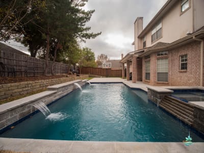 Custom pool and inground spa crafted with clean architectural lines and thoughtful proportions at a Colleyville, Tarrant County, TX outdoor living space.