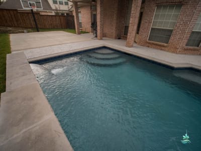 Establishing overview of a custom outdoor living space at the Benegal residence in Colleyville, Tarrant County, TX, reflecting clean architectural lines and thoughtful proportions.