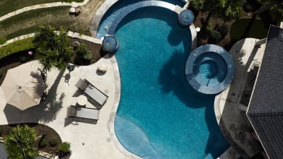 Aerial view of a complete outdoor environment crafted for an industry professional residence in Fort Worth, Tarrant County, TX, revealing the full scope of the custom design-build collaboration.