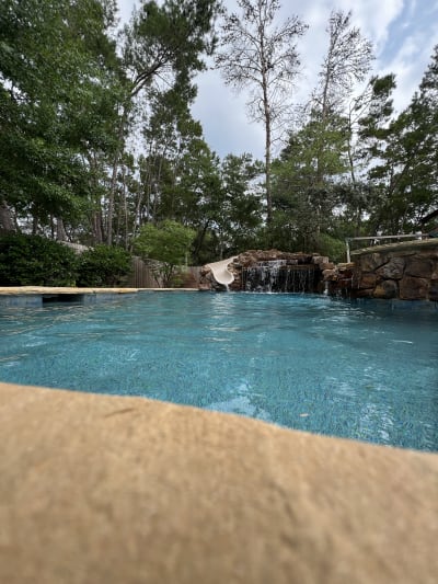 Luxury in-ground pool with spa and water features at the Colon Residence in Santa Rosa Beach, FL.