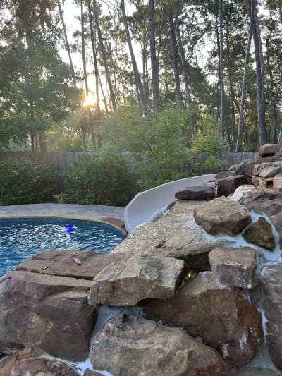 Luxurious in-ground pool and spa in a landscaped backyard at the Colon Residence in Santa Rosa Beach, FL.