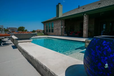 Establishing overview of a custom spa retreat crafted for the Erdmann residence in Godley, Johnson County, TX, set within a rural countryside living environment.