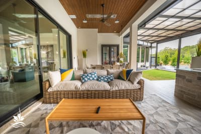 Close-detail view of the 7×7 custom spa with Mini Pebble Arctic White plaster and pool-match tile finish in a Flower Mound, Denton County, TX outdoor living space.