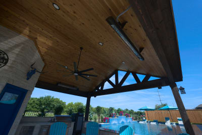 Architectural ceiling framework showcases the structural elegance of covered outdoor living spaces, with exposed beam construction creating sophisticated overhead design elements.