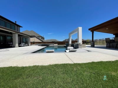 Aerial perspective of the Phillips Residence complete outdoor environment crafted by Selah Pools in Roanoke, Denton County, TX, showcasing integrated outdoor living with architectural design-build precision.