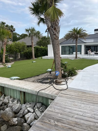 Luxury backyard pool, spa, and outdoor kitchen at the Sheldon Residence in Miramar Beach, FL.