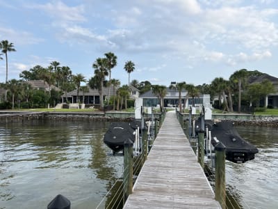 Waterfront dock scene at the Sheldon Residence luxury pool project in Miramar Beach, FL.