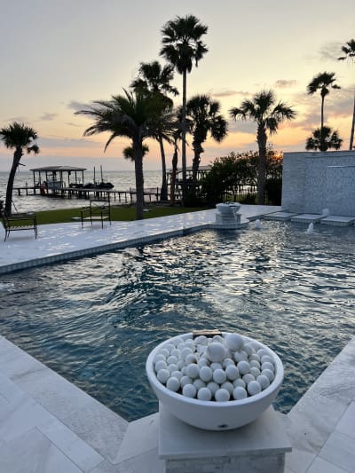 Luxury pool with spa and fountain overlooking the Gulf at sunset, Miramar Beach, FL by Almar Jackson Pools, Inc.