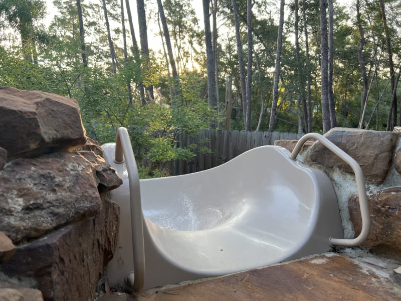 Outdoor spa with raised beam and sheer descent water feature at the Colon Residence in Santa Rosa Beach, FL.