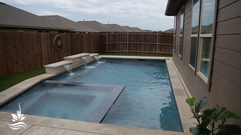 A Family Pool Built for Every Season in Justin — glass tile & pebble plaster — Justin, TX