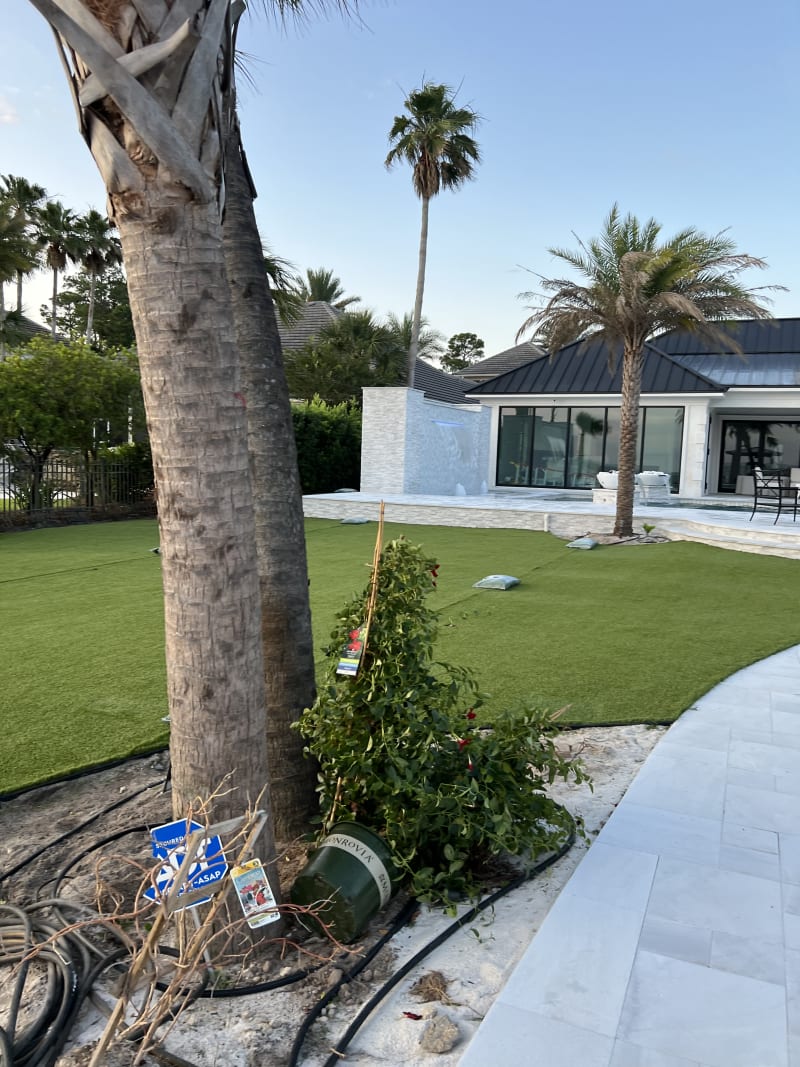 Backyard pool and landscaping design at the Sheldon Residence by Selah Pools Luxury Outdoor Living in Miramar Beach, FL.