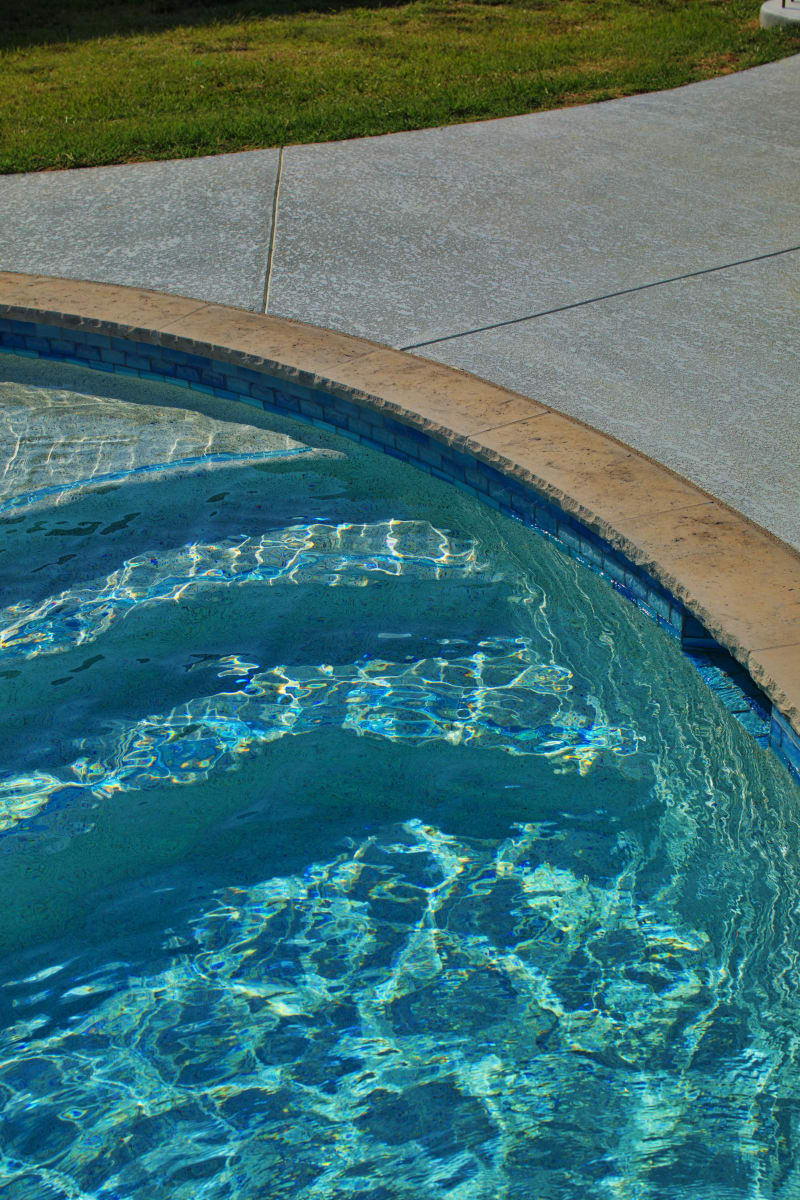 42-inch fire pit with Grey Leuders stone veneer anchoring the outdoor gathering space — Seeley family