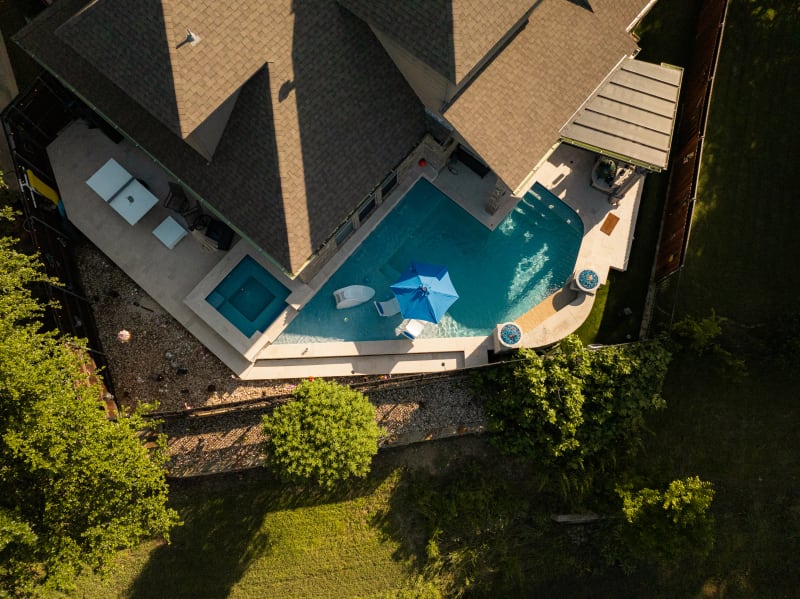 Small yard with a big inground swimming pool and spa