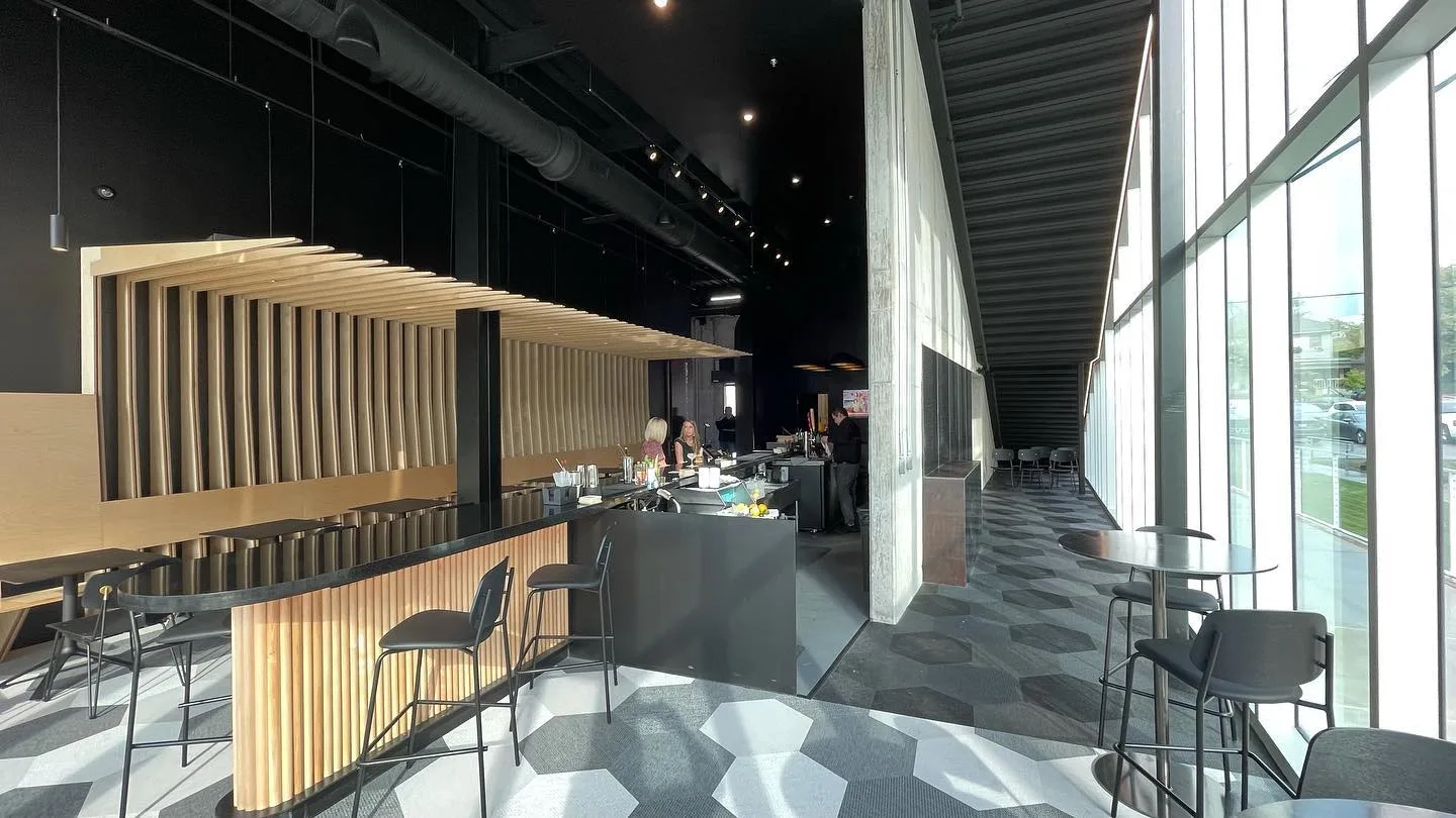 Wide shot of people sitting at the lounge bar, highlighting the venue.