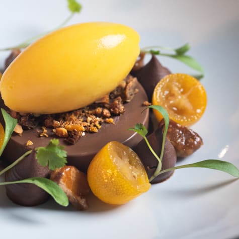 Cercle V member Michael Kwan creates the OABIKA poached kumquats, caramelised macadamia & Nyangbo ganache