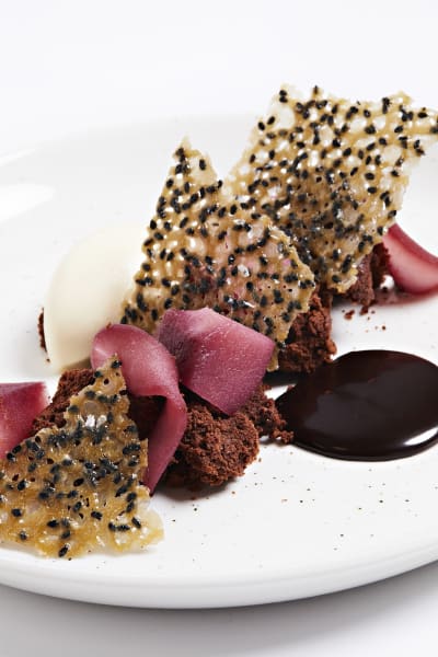 Warm chocolate cake with red wine poached pears