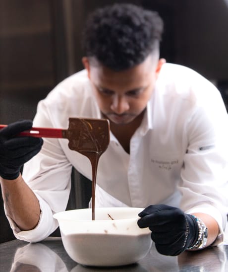 Chef Ishan stirring chocolate