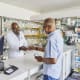 Patient picking up a prescription from the pharmacy