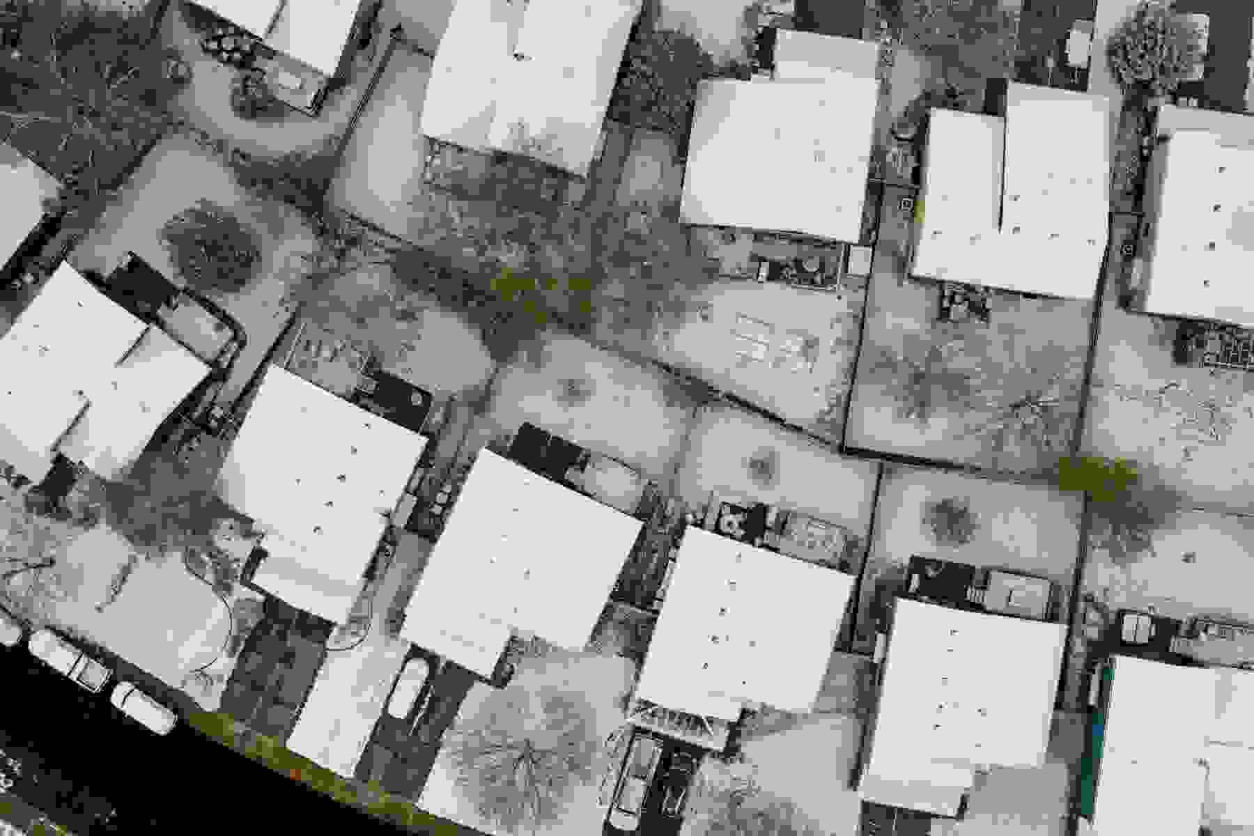An aerial view of a snowy neighborhood