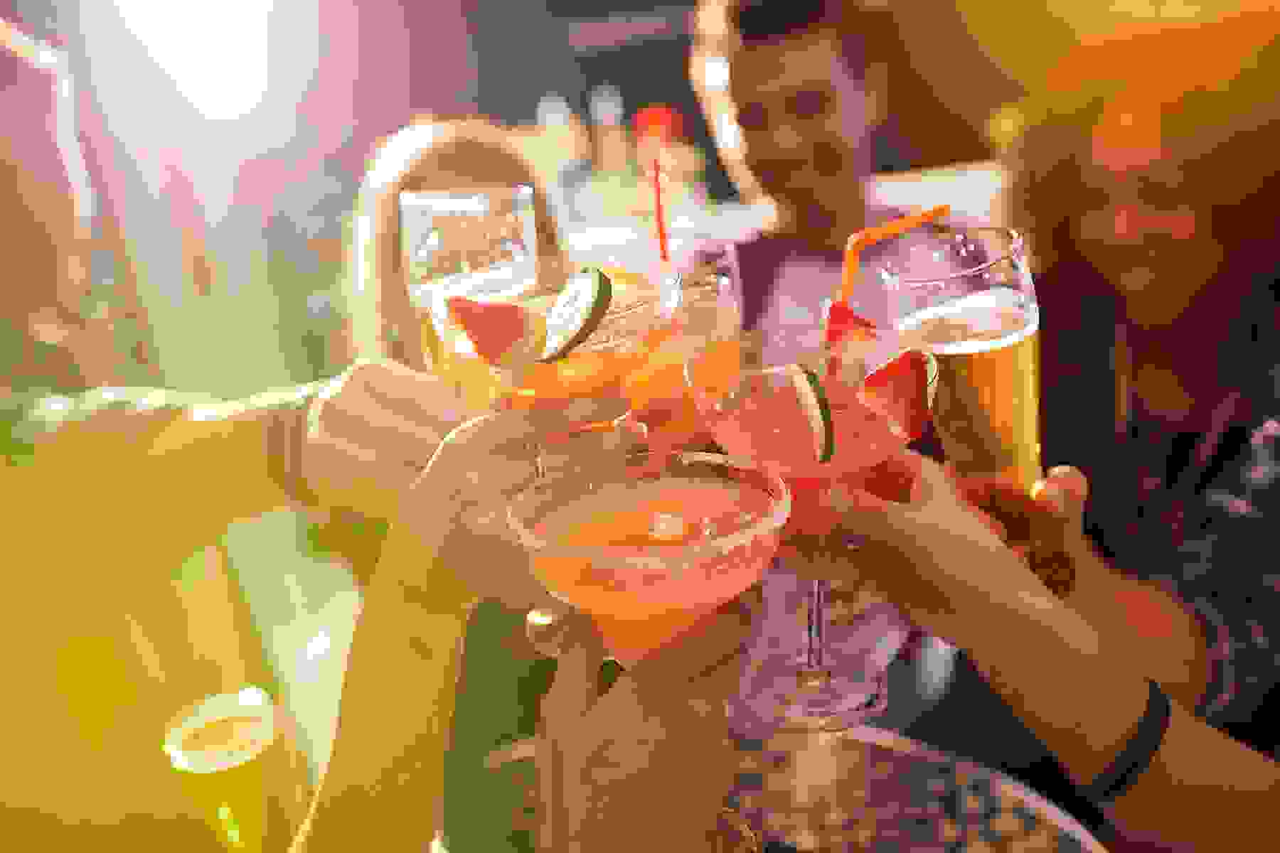 A group of people toasting with their drinks at a nightclub