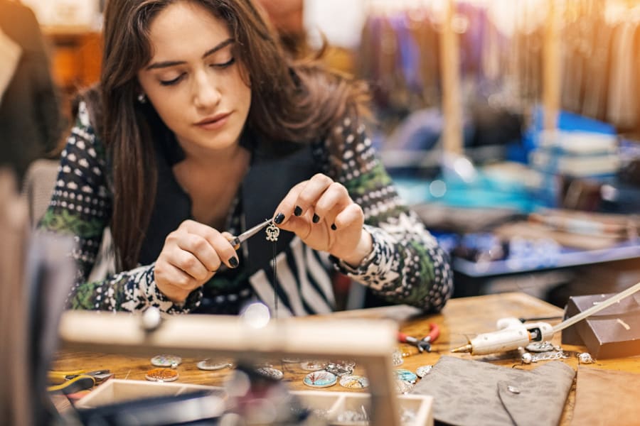 woman fixing jewelry